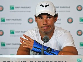 Nine-time champion Rafael Nadal, of Spain, announces he is pulling out of the French Open because of an injury to his left wrist at the Roland Garros stadium in Paris, France. (AP Photo/Michel Euler)