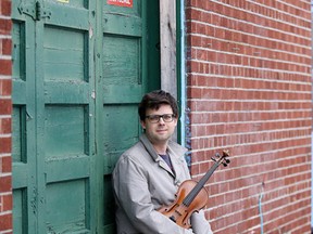 Sudbury-based violinist Christian Robinson at the old Northern Brewery building on Lorne Street  in Sudbury, Ont.  Robinson will be holding a solo concert in the building on Saturday night. Gino Donato/Sudbury Star/Postmedia Network