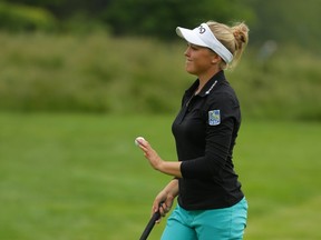 Brooke Henderson of Canada waves to the crowd after putting out on the 18th hole during the first round of the ShopRite LPGA Classic presented by Acer on the Bay Course at the Stockton Seaview Hotel & Golf Club in Galloway, N.J., on June 3, 2016. (Hunter Martin/Getty Images/AFP)