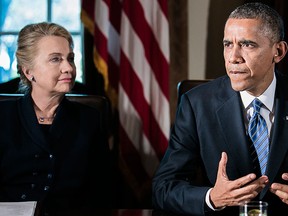 Hillary Clinton (left) and U.S. President Barack Obama are seen together in this Nov. 28, 2012 file photo. (Photo by T.J. Kirkpatrick-Pool/Getty Images)
