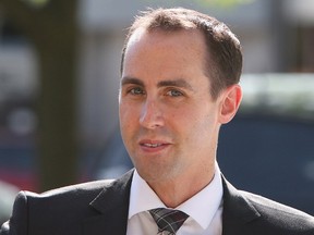 Defendant Michael Sona walks to the courthouse in Guelph, Ont., Wednesday, June 4, 2014. The last unresolved legal appeal of the 2011 robocalls scandal is at an end after the Federal Court of Appeal tossed out a bid to overturn the federal election results from Guelph, Ont. Sona, was convicted and sentenced to nine months in jail for his role in the Guelph voter suppression scandal. THE CANADIAN PRESS/Dave Chidley