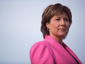 British Columbia Premier Christy Clark listens to a question while speaking about shadow flipping in the real estate industry, in Vancouver, B.C., on Friday March 18, 2016.Clark revealed an intensely personal story today while explaining why her Liberal government is backing a private members bill on sexual assault. (THE CANADIAN PRESS/Darryl Dyck)