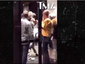 Justin Bieber is seen in a video obtained by TMZ punching an unidentified man after an NBA finals game in Cleveland, Ohio. (Screen shot)
