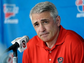 In this May 5, 2014, file photo, Carolina Hurricanes general manager Ron Francis takes questions from members of the media during a news conference in Raleigh, N.C. (AP Photo/Gerry Broome, File)