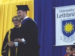 Janice Varzari, the University of Lethbridge's chancellor, congratulates Patrick McFarland, a former County Central High School student, for earning the University's School of Graduate Studies Medal of Merit, Master of Education. McFarland received the medal during the University’s Spring Convocation, held June 2 and 3 at the 1st Choice Savings Centre for Sport and Wellness gymnasium. Submitted photo
