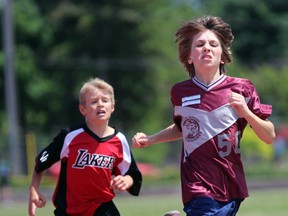 Ryan Hayter from St. Peter Canisius leads the intermediate boys'  division two 1,500-metre run with Ryan Richardson from St. John Fisher behind him during the  St. Clair Catholic District School Board's track and field meet on Thursday June 9, 2016 in Sarnia, Ont. Hayter finished first and Richardson second. (Terry Bridge/Sarnia Observer/Postmedia Network)