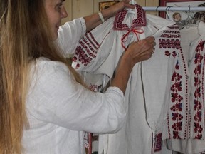 Organizer of the Folklore Festival, Nadia Luciuk, displays her great grandmother's hand-woven Ukrainian dress in her home in Kingston. (Julia Balakrishnan/For The Whig-Standard)