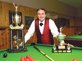 Greater Sudbury's Fern Loyer poses with some of his recent hard-won hardware at Plaza Bowl. John Lappa/The Sudbury Star