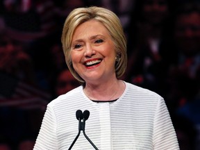 Democratic presidential candidate Hillary Clinton speaks in New York on June 7, 2016. Powered by a solid triumph in California, Clinton seizes her place in history as the first women to become a presumptive presidential nominee and sets out to unite a fractured party to confront Donald Trump. (AP Photo/Julio Cortez, File)