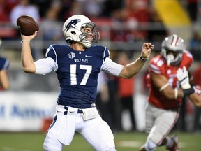 Quarterback Cody Fajardo of the Nevada Wolf Pack throws against the UNLV Rebels during their game at Sam Boyd Stadium on November 29, 2014 in Las Vegas.  (Ethan Miller/Getty Images/AFP)