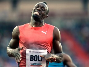 Jamaican sprinter Usain Bolt grimaces while crossing the finish line of the men's 100m event, at the Golden Spike athletic meeting in Ostrava, Czech Republic, Friday, May 20, 2016. (AP Photo/Petr David Josek)