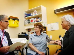 Dr. Pandu Shetty, chief of medicine, and registered nurse Carol Lepore, right, meet with a patient in Bluewater Health's secondary stroke prevention clinic in Sarnia. An awareness event at Sarnia's hospital about the link between dementia and stroke is planned for June 15. (Handout)