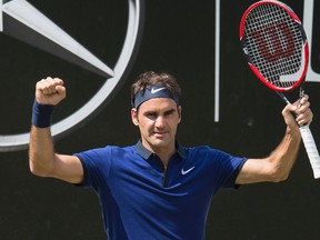 Switzerland's Roger Federer celebrates after defeating Germany's Florian Mayer in their quarterfinal match at the ATP Mercedes Cup tennis tournament in Stuttgart, southwestern Germany, on June 10, 2016.  (AFP PHOTO/THOMAS KIENZLE)