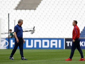 England's coach Roy Hodgson and Wayne Rooney inspect the Stade Velodrome in Marseille on June 10, 2016. (AP Photo/Thanassis Stavrakis)