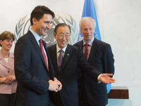 Canadian Prime Minister Justin Trudeau (left) is welcomed by United Nations General Secretary Ban Ki-moon as Foreign Affairs Minister Stephane Dion looks on at the United Nations headquarters in New York, Wednesday March 16, 2016. THE CANADIAN PRESS/Adrian Wyld