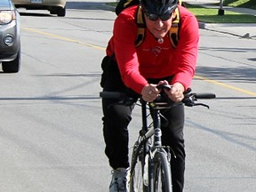 Roel Bus cycles up East Street, not far from the fire hall where he works. Bus plans to cycle 500 kilometres in June, raising $500 in the SickKids Great Cycle Challenge Canada to help fight kids' cancer. (Tyler Kula/Sarnia Observer)