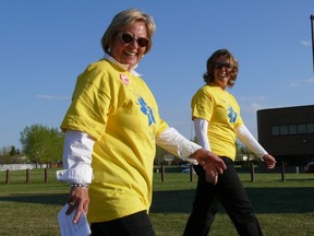 Brenda Moon, left, walks the Survivor Lap during the 2009 Airdrie Relay for Life. Moon has been diagnosed with cancer twice in her life, and has been cancer free for more than one year.  - photo submitted