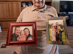 Richard Barnhart holds up pictures of his family at his home in Spruce Grove on Tuesday, June 7, 2016. - Photo by Yasmin Mayne