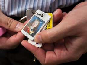 Ron Bailey of Woodstock shows a picture of his daughter, Mandy, who took her own life on Feb. 29, one of five suicides in Woodstock that prompted a student walkout Tuesday asking for more help for mental health issues. Bailey attended the rally. (MIKE HENSEN, The London Free Press)