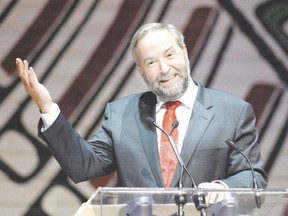 NDP Leader Tom Mulcair addresses the annual press gallery dinner, which marked its 150th anniversary last weekend. Originally an off-the-record event, the annual shindig went public in 1994, inspiring speakers to ?up their game.? (Justin Tang/The Canadian Press)