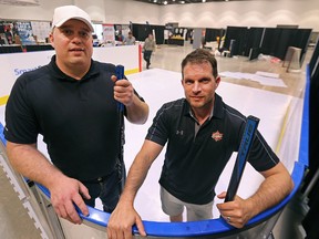 Chad Balmer (left) and Jarret Hannah, organizers of the first Canadian Hockey Expo taking place at the RBC Convention Centre in Winnipeg this weekend, take to the synthetic ice on Friday. (Kevin King/Winnipeg Sun)
