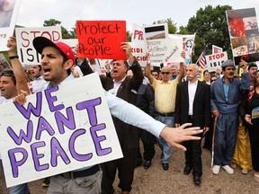 Kurdish activists rally in defense of Yazidi (also known as Ezidi) people living in Sinjar (known in Kurdish as Shingal), outside the White House in Washington, in 2014. (FILE PHOTO)