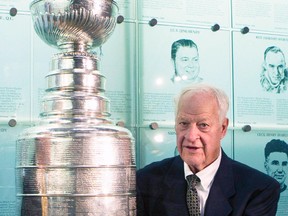 In this Nov. 14, 2011, file photo, Hockey Hall of Famer Gordie Howe poses beside the Stanley Cup at the Hall of Fame in Toronto. Howe, the rough-and-tumble Canadian farm boy whose boundless blend of talent and toughness made him the NHL’s quintessential star during a career that lasted into his 50s, died Friday, June 10, 2016. The man forever known as “Mr. Hockey” was 88. (Frank Gunn/The Canadian Press via AP, File)