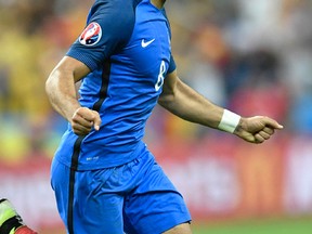 France's Dimitri Payet celebrates after scoring his side’s second goal during the Euro 2016 Group A soccer match between France and Romania at the Stade de France in Saint-Denis, north of Paris, on Friday, June 10, 2016. (Martin Meissner/AP Photo)