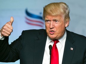 Republican presidential candidate Donald Trump gives a thumbs-up while addressing the Faith and Freedom Coalition's Road to Majority Conference in Washington, Friday, June 10, 2016. (AP Photo/Cliff Owen)