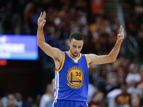 Warriors guard Stephen Curry celebrates a basket against the Cavaliers during the second half of Game 4 of the NBA Finals in Cleveland on Friday, June 10, 2016. (Tony Dejak/AP Photo)