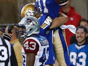 Winnipeg Blue Bombers' Fred Williams (71) celebrates his touchdown against the Montreal Alouettes during the second half of pre-season CFL action in Winnipeg Wednesday, June 8, 2016. THE CANADIAN PRESS/John Woods
