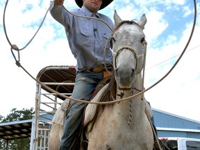 Robert Borba is being called a hero after chasing down an alleged bicycle thief with his horse Long John, and nabbing him with a lasso in a Wal-Mart parking lot, Friday, June 10, 2016, in Eagle Point, Ore. Borba was at the Eagle Point store loading dog food and a camping tent into his truck when he heard a woman screaming that someone was trying to steal her bike, the Medford Mail Tribune reports. Eagle Point police Sgt. Darin May said officers arrived and found the lassoed man and bike on the ground in the parking lot. (Denise Baratta/The Medford Mail Tribune via AP)