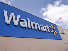 Signage at a Laval, Que., Walmart store is seen on Tuesday, May 3, 2016. Walmart Canada says its customers will no longer be allowed to use Visa cards to make purchases at the store. THE CANADIAN PRESS/Ryan Remiorz