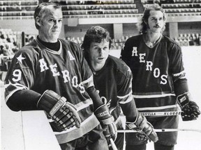 Gordie, Mark (centre) and Marty Howe suit up for the WHA's Houston Aeros in a 1975 handout photo from the new book "Mr. Hockey." (THE CANADIAN PRESS/HO-Howe Family)