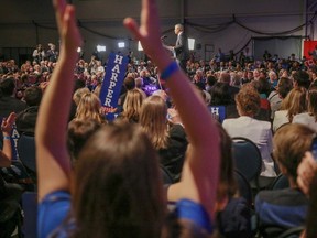 The crowd cheers as Stephen Harper addresses the country at the Harper headquarters in the TELUS Convention Centre in Calgary, Ab., on Monday October 19, 2015. Mike Drew/Calgary Sun/Postmedia Network