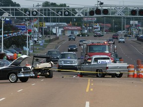 Vehicles involved in a fatal accident are seen crashed in Selmer, Tenn., Saturday, June 11, 2016. The Tennessee Highway Patrol said a few people are dead after a vehicle drove through a barricade at the Rockabilly Highway Revival Festival in Selmer. (C.b. Schmelter/The Jackson Sun via AP)