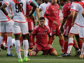 Bryan Olivera of Ottawa Fury FC is surrounded by his teammates and Rayo OKC players after a scoring chance on June 11. (David Kawai)