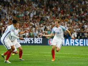 England's Eric Dier, right, celebrates after scoring the opening goal during the Euro 2016 Group B soccer match between England and Russia, at the Velodrome stadium in Marseille, France, Saturday, June 11, 2016. (AP Photo/Kirsty Wigglesworth)