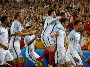England's Eric Dier, 2nd right, celebrates after scoring the opening goal during the Euro 2016 Group B soccer match between England and Russia, at the Velodrome stadium in Marseille, France, Saturday, June 11, 2016. (AP Photo/Kirsty Wigglesworth)