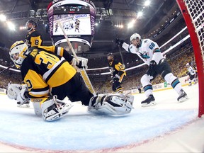 San Jose Sharks' Melker Karlsson, right, celebrates his goal against Pittsburgh Penguins goalie Matt Murray (30) during the first period in Game 5 of the NHL hockey Stanley Cup Finals on Thursday, June 9, 2016, in Pittsburgh. (Bruce Bennett/Getty Images, Pool via AP)