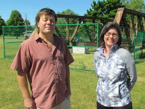 Steve Loxton and Vicki Schauteet, members of Friends of the Cull Drain Bridge, stand on Sunday June 12, 2016 in Sarnia, Ont., next to the former bridge's save steel trusses in Mike Weir Park. The trusses were a stop on the weekend's Doors Open tour.