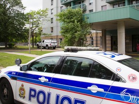 A police cruiser sat outside 160 Charlotte Street Sunday June 12, 2016 as they were investigating after a man was found dead on Saturday night. (Ashley Fraser/Postmedia Network)