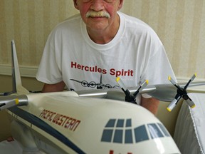 Erik Strand, a former Pacific Western Airlines Hercules aircraft pilot, poses with a scale model of a Lockheed Hercules L-100-20 commercial air freighter at the Ramada Hotel in Edmonton. (PHOTO BY LARRY WONG/POSTMEDIA NETWORK