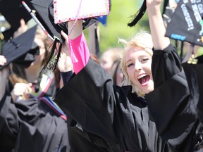 Social work graduate Brittney Drouin joins in a cheer before Algoma University's spring graduation at Roberta Bondar Pavilion in Sault Ste. Marie on June 11, 2016. (BRIAN KELLY/Postmedia Network)
