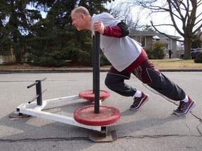 Toronto Police Supt. Heinz Kuck, commander of 11 Division, is preparing to push a weighted sled from his station to the Dovercourt Boys and Girls Club in an effort to raise money for a youth music program. (TRAVIS KUCK PHOTO)