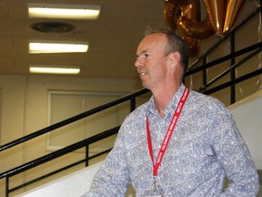 Michael Kehler, Queen Elizabeth Collegiate and Vocational Institute graduate of 1980, reflects on his time at the school at the QECVI Farewell Celebration in Kingston, Ont. on Saturday June 11, 2016. Steph Crosier/Kingston Whig-Standard/Postmedia Network