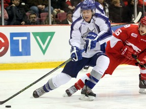 Sudbury Wolves defenceman Reagan O'Grady (7) and Soo Greyhounds centre Morgan Frost jockey for puck possession during first-period play Wednesday, Jan. 20, 2016 at Essar Centre in Sault Ste. Marie, Ont. JEFFREY OUGLER/SAULT STAR/POSTMEDIA NETWORK
