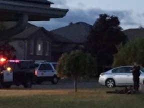 Armed police surround a house in a subdivision just east of Walmart in Quinte West Sunday night.