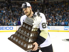 Sidney Crosby of the Pittsburgh Penguins celebrates being awarded the Conn Smythe after their 3-1 victory to win the Stanley Cup against the San Jose Sharks.  (Bruce Bennett/Getty Images/AFP)