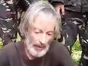 Abu Sayyaf, the Philippine militant group behind the murder of Canadian hostage John Ridsdel, has reportedly released a new video apparently showing Canadian hostage Robert Hall pleading with the government to “meet the demand” of his captors. (SITE Intelligence screengrab)